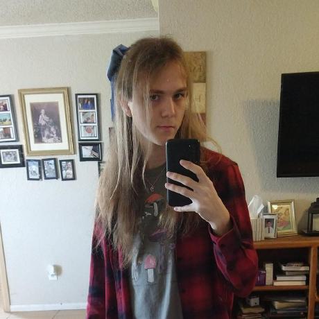 River, wearing a hair bow and a red flannel. Mirror selfie